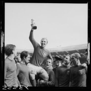 Bobby Moore lifts the 'Jules Rimet' trophy after England win the 1966 World Cup, defeating West Germany 4-2 (aet).