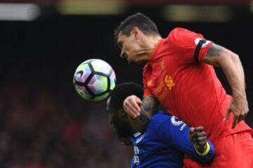 Liverpool's Croatian defender Dejan Lovren (R) vies with Everton's Belgian striker Romelu Lukaku during the English Premier League football match between Liverpool and Everton at Anfield in Liverpool, north west England on April 1, 2017.