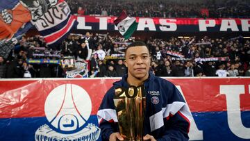 Soccer Football - Ligue 1 - Paris St Germain v Nantes - Parc des Princes, Paris, France - March 4, 2023 Paris St Germain's Kylian Mbappe celebrates with a trophy during the ceremony after becoming Paris St Germain's all time top goalscorer with 201 goals Franck Fife/POOL via REUTERS