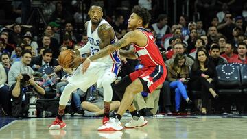 Feb 24, 2017; Philadelphia, PA, USA; Philadelphia 76ers forward Robert Covington (33) looks to pass as Washington Wizards forward Kelly Oubre Jr. (12) defends during the second quarter of the game at the Wells Fargo Center. Mandatory Credit: John Geliebter-USA TODAY Sports