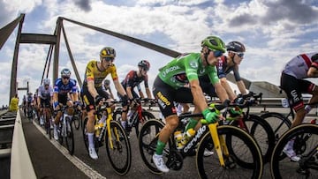 OOIJ - Atmospheric image of Rohan Dennis, Primoz Roglic (lr) of the Jumbo Visma team in the lead of the peloton that passes the Waal over the Prince Willem Alexander bridge near Ooij during the second stage of the Tour of Spain (Vuelta a Espana). The second stage of the Vuelta goes from Den Bosch to Utrecht. ANP VINCENT JANNINK (Photo by ANP via Getty Images)