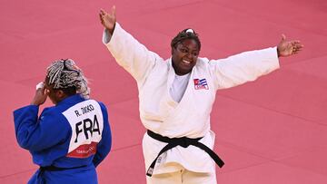 (FILES) France's Romane Dicko (blue) reacts after being defeated by Cuba's Idalys Ortiz at the end of their judo women's +78kg semifinal bout during the Tokyo 2020 Olympic Games at the Nippon Budokan in Tokyo on July 30, 2021. Idalys Ortiz, the Cuban judo legend who will go to the Santiago PAN AM Games for her fourth continental crown, had to polish her technique fighting men because she never found rivals of her level on the island. (Photo by Charly TRIBALLEAU / AFP)