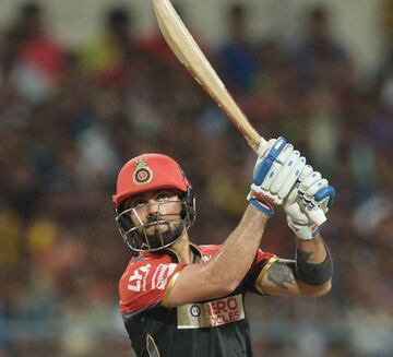 Kohli watches the ball rise high as it often does after being introduced to his willow.