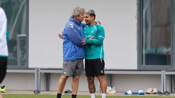 Cucho, con Pellegrini.