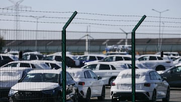 Cars of the Volkswagen Group intended for export to the United States are seen behind a fence at the seaport of Emden near the estuary, where the River Ems flows into the North Sea, in Emden, Germany, April 2, 2025. REUTERS/Wolfgang Rattay TPX IMAGES OF THE DAY