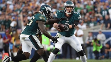 LOS ANGELES, CA - DECEMBER 10: Quarterback Nick Foles #9 of the Philadelphia Eagles hands off the ball to running back Jay Ajayi #36 of the Philadelphia Eagles during the fourth quarter against Los Angeles Rams at Los Angeles Memorial Coliseum on December 10, 2017 in Los Angeles, California. Foles replaced injured starting quarterback Carson Wentz.   Kevork Djansezian/Getty Images/AFP
 == FOR NEWSPAPERS, INTERNET, TELCOS &amp; TELEVISION USE ONLY ==