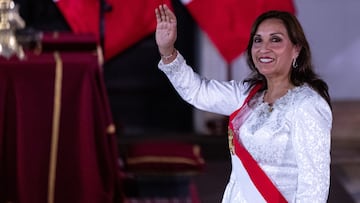 10 December 2022, Peru, Lima: Dina Boluarte, interim president of Peru, waves during the swearing-in ceremony of cabinet members at the Government Palace. Photo: Lucas Aguayo Araos/dpa (Photo by Lucas Aguayo Araos/picture alliance via Getty Images)