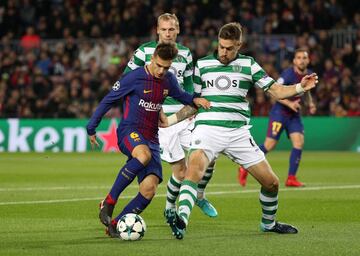 Denis Suárez con Sebastian Coates.