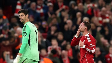 Soccer Football - UEFA Champions League - Liverpool v Real Madrid - Anfield, Liverpool, Britain - November 4, 2025 Liverpool's Alexis Mac Allister celebrates scoring their first goal alongside Real Madrid's Thibaut Courtois REUTERS/Phil Noble
