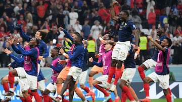 France's players celebrate their victory in the Qatar 2022 World Cup semi-final football match between France and Morocco at the Al-Bayt Stadium in Al Khor, north of Doha on December 14, 2022. (Photo by FRANCK FIFE / AFP)