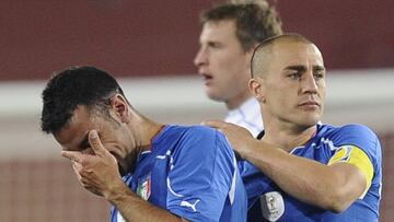 Italy&#039;s defender Fabio Cannavaro (R) consoles Italy&#039;s striker Fabio Quagliarella after the Group F first round 2010 World Cup football match Italy versus Slovakia on June 24, 2010 at Ellis Park stadium in Johannesburg. Slovakia won the match 3-2