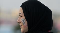 A woman arrives at the Al-Bayt Stadium in Al Khor, north of Doha, on November 20, 2022, before the kick-off match of the Qatar 2022 World Cup football tournament between Qatar and Ecuador. (Photo by JUAN MABROMATA / AFP)