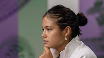 Britain's Emma Raducanu speaks to the media in the Main Interview Room following her defeat against France's Caroline Garcia in their women's singles tennis match on the third day of the 2022 Wimbledon Championships at The All England Tennis Club in Wimbledon, southwest London, on June 29, 2022. - RESTRICTED TO EDITORIAL USE (Photo by Joe TOTH / various sources / AFP) / RESTRICTED TO EDITORIAL USE (Photo by JOE TOTH/AFP via Getty Images)