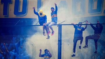 Supporters of Boca Juniors cheer for their team during the first leg match of the all-Argentine Copa Libertadores final against River Plate, at La Bombonera stadium in Buenos Aires, on November 11, 2018. 