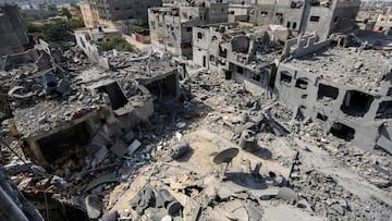 KHAN YUNIS, GAZA - OCTOBER 23: General view of buildings which were destroyed during Israeli air raids in the southern Gaza Strip on October 23, 2023 in Khan Yunis, Gaza. Gazans are evacuating to the south as advised by the Israeli government, ahead of an expected Israeli ground offensive. Israel has sealed off Gaza, leaving the entire population without fuel, water or aid, and launched sustained retaliatory air strikes, which have killed more than 2,000 people and some 400,000 displaced, after a large-scale attack by Hamas. On October 7, the Palestinian militant group Hamas launched a surprise attack on Israel from Gaza by land, sea, and air, killing over 1,300 people and wounding around 2,800. Israeli soldiers and civilians have also been taken hostage by Hamas and moved into Gaza. The attack prompted a declaration of war by Israeli Prime Minister Benjamin Netanyahu and the announcement of an emergency wartime government. (Photo by Ahmad Hasaballah/Getty Images)