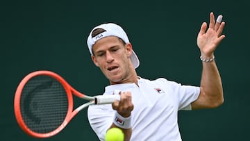 Argentina's Diego Schwartzman returns the ball Britain's Liam Broady toduring their men's singles tennis match on the fourth day of the 2022 Wimbledon Championships at The All England Tennis Club in Wimbledon, southwest London, on June 30, 2022. (Photo by Glyn KIRK / AFP) / RESTRICTED TO EDITORIAL USE