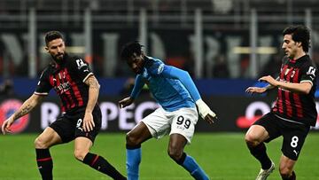 (From L) AC Milan's French forward Olivier Giroud, Napoli's Cameroonian midfielder Andre Zambo Anguissa and AC Milan's Italian midfielder Sandro Tonali go for the ball during the UEFA Champions League quarter-finals first leg football match between AC Milan and SSC Napoli on April 12, 2023 at the San Siro stadium in Milan. (Photo by GABRIEL BOUYS / AFP) (Photo by GABRIEL BOUYS/AFP via Getty Images)