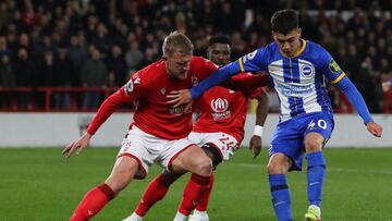 Nottingham Forest's English defender Joe Worrall (L) fights for the ball with Brighton's Argentinian midfielder Facundo Buonanotte during the English Premier League football match between Nottingham Forest and Brighton and Hove Albion at The City Ground in Nottingham, central England, on April 26, 2023. (Photo by Geoff Caddick / AFP) / RESTRICTED TO EDITORIAL USE. No use with unauthorized audio, video, data, fixture lists, club/league logos or 'live' services. Online in-match use limited to 120 images. An additional 40 images may be used in extra time. No video emulation. Social media in-match use limited to 120 images. An additional 40 images may be used in extra time. No use in betting publications, games or single club/league/player publications. /