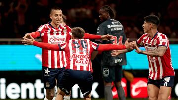 Guadalajara's forward #25 Roberto Alvarado (L) celebrates with teammate midfielder #50 Mateo Chavez after scoring during the Liga MX Clausura football match between Guadalajara and Tijuana at the Akron stadium in Zapopan, Jalisco state, Mexico on February 9, 2025. (Photo by Ulises Ruiz / AFP)