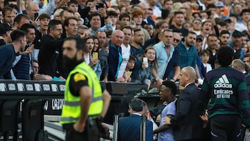 (FILES) Supporters react as Real Madrid's Brazilian forward Vinicius Junior leaves after being sent off the pitch by the referee during the Spanish league football match between Valencia CF and Real Madrid CF at the Mestalla stadium in Valencia on May 21, 2023. Spanish prosecutors opened a probe on May 22, 2023 into racist chants aimed at Real Madrid's star forward Vinicius Junior during a match as the football federation president admitted the country had a "problem" with racism. (Photo by JOSE JORDAN / AFP)