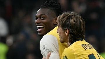 AC Milan's Portuguese forward #10 Rafael Leao celebrates with AC Milan's Croatian midfielder #14 Luka Modric after winning the Italian Serie A football match between AC Milan and Fiorentina at San Siro stadium in Milan, northern Italy, on October 19, 2025. (Photo by Stefano RELLANDINI / AFP)