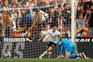 Valencia's Spanish forward Diego Lopez scores the opening goal during the Spanish league football match between Valencia CF and Real Madrid CF at the Mestalla stadium in Valencia on May 21, 2023. (Photo by JOSE JORDAN / AFP)