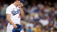 (FILES) In this file photo taken on May 30, 2022, Walker Buehler, #21 of the Los Angeles Dodgers, reacts as he leaves the mound during the second inning against the Pittsburgh Pirates at Dodger Stadium in Los Angeles, California. - Los Angeles Dodgers ace Walker Buehler faces more than a year on the sidelines after undergoing surgery to reconstruct his injured elbow on August 23, 2022. (Photo by Harry How / GETTY IMAGES NORTH AMERICA / AFP)