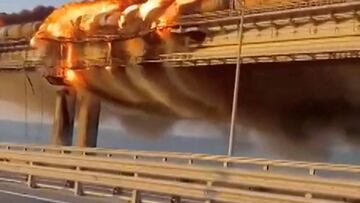 A view shows a fire on the Kerch bridge in the Kerch Strait, Crimea, October 8, 2022, in this screen grab from a handout video. Video Obtained By Reuters/Handout via REUTERS ATTENTION EDITORS- THIS IMAGE HAS BEEN SUPPLIED BY A THIRD PARTY. NO RESALES. NO ARCHIVES