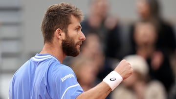 France's Corentin Moutet reacts after a point during his men's singles round of sixteen match against Italy's Jannik Sinner on Court Philippe-Chatrier on day eight of the French Open tennis tournament at the Roland Garros Complex in Paris on June 2, 2024. (Photo by Alain JOCARD / AFP)