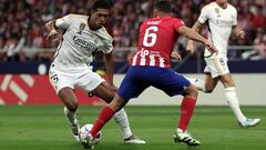 Real Madrid's English midfielder #5 Jude Bellingham vies with Atletico Madrid's Spanish midfielder #06 Koke during the Spanish Liga football match between Club Atletico de Madrid and Real Madrid CF at the Metropolitano stadium in Madrid on September 24, 2023. (Photo by Thomas COEX / AFP)