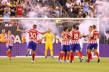 Atlético Madrid players celebrate during their 7-3 thrashing of Real Madrid in the International Champions Cup.