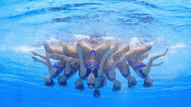What is the difference between artistic swimming and synchronized swimming?