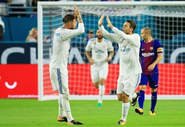 Mateo Kovacic celebrates with teammates after scoring a goal in the first half against the Barcelona