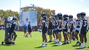 Dallas Cowboys players participate in drills on the first day of training camp