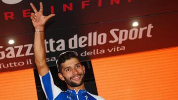Colombian Cyclist Fernando Gaviria from QuickStep - Floors celebrates on the podium after winning the 12th stage of the 100th Giro d'Italia, Tour of Italy cycling race from Forl?i to Reggio Emilia of 100th Giro d'Italia, Tour of Italy on May 18, 2017 in Reggio Emilia. / AFP PHOTO / LUK BENIES