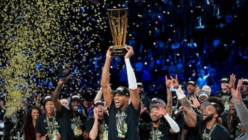 Dec 17, 2024; Las Vegas, Nevada, USA; Milwaukee Bucks forward Giannis Antetokounmpo (34) celebrates with the trophy and teammates after winning the Emirates NBA Cup championship game against the Oklahoma City Thunder at T-Mobile Arena. Mandatory Credit: Kyle Terada-Imagn Images