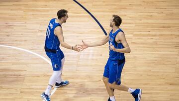 Apr 9, 2019; Dallas, TX, USA; Dallas Mavericks forward Luka Doncic (77) and forward Dirk Nowitzki (41) celebrate during the second half against the Phoenix Suns at the American Airlines Center. Mandatory Credit: Jerome Miron-USA TODAY Sports