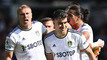 (From L) Leeds United's Danish defender Rasmus Kristensen and Leeds United's Spanish midfielder Marc Roca celebrate at the end of the English Premier League football match between Leeds United and Chelsea at Elland Road in Leeds, northern England, on August 21, 2022. - Leeds won 3 - 0 against Chelsea. - RESTRICTED TO EDITORIAL USE. No use with unauthorized audio, video, data, fixture lists, club/league logos or 'live' services. Online in-match use limited to 120 images. An additional 40 images may be used in extra time. No video emulation. Social media in-match use limited to 120 images. An additional 40 images may be used in extra time. No use in betting publications, games or single club/league/player publications. (Photo by Paul ELLIS / AFP) / RESTRICTED TO EDITORIAL USE. No use with unauthorized audio, video, data, fixture lists, club/league logos or 'live' services. Online in-match use limited to 120 images. An additional 40 images may be used in extra time. No video emulation. Social media in-match use limited to 120 images. An additional 40 images may be used in extra time. No use in betting publications, games or single club/league/player publications. / RESTRICTED TO EDITORIAL USE. No use with unauthorized audio, video, data, fixture lists, club/league logos or 'live' services. Online in-match use limited to 120 images. An additional 40 images may be used in extra time. No video emulation. Social media in-match use limited to 120 images. An additional 40 images may be used in extra time. No use in betting publications, games or single club/league/player publications. (Photo by PAUL ELLIS/AFP via Getty Images)