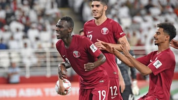 Qatar&#039;s forward Almoez Ali (L) celebrates his goal, his team&#039;s second, during the 2019 AFC Asian Cup semi-final football match between Qatar and UAE at the Mohammed Bin Zayed Stadium in Abu Dhabi on January 29, 2019. 