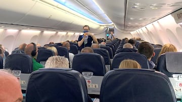 DUSSELDORF, GERMANY - JUNE 15: A flight attendant gives safety instructions to tourists prior to the departure of TUIfly flight X3 2312, the first package tour flight to Mallorca since March, at Dusseldorf Airport during the coronavirus pandemic on June 1