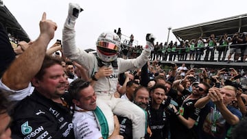 (FILES) In this file photo taken on November 11, 2018 Mercedes&#039; British driver Lewis Hamilton celebrates after winning the F1 Brazil Grand Prix, while Mercedes took the constructors title, at the Interlagos racetrack in Sao Paulo, Brazil. (Photo by EVARISTO SA / AFP)