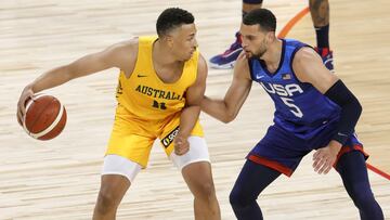 Dante Exum of the Australia Boomers is guarded by Zach LaVine of the United States during an exhibition game at Michelob Ultra Arena ahead of the Tokyo Olympic Games on July 12, 2021 in Las Vegas, Nevada.