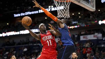 Feb 14, 2019; New Orleans, LA, USA; New Orleans Pelicans guard Jrue Holiday (11) shoots as Oklahoma City Thunder forward Nerlens Noel (3) defends during the second half at the Smoothie King Center. Mandatory Credit: Derick E. Hingle-USA TODAY Sports