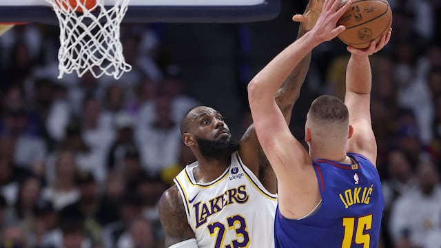 DENVER, COLORADO - APRIL 20: LeBron James #23 of the Los Angeles Lakers guards Nikola Jokic #15 of the Denver Nuggets in the first quarter during game one of the Western Conference First Round Playoffs at Ball Arena on April 20, 2024 in Denver, Colorado. NOTE TO USER: User expressly acknowledges and agrees that, by downloading and or using this photograph, User is consenting to the terms and conditions of the Getty Images License Agreement. Matthew Stockman/Getty Images/AFP (Photo by MATTHEW STOCKMAN / GETTY IMAGES NORTH AMERICA / Getty Images via AFP)