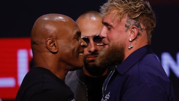 Former US boxer Mike Tyson (L) and YouTube sensation Jake Paul face off during a press conference at the Apollo Theatre in New York, on May 13, 2024. Former heavyweight boxing champion Mike Tyson's July 20 fight against YouTube sensation Jake Paul in Dallas will be a sanctioned heavyweight professional bout, fighters and promoters announced on April 29. The fight will be over eight two-minute rounds with the result to count on the record of both Paul and Tyson, who lost his last official bout in 2005. (Photo by Kena Betancur / AFP)