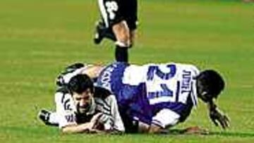 TURIEL SECÓ A FIGO. El defensa dio una lección de defensa viril y anuló por completo al delantero portugués.