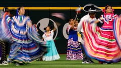ARLINGTON, TX - SEPTEMBER 23: Folklorico dancers perform in centerfield to celebrate Hispanic Heritage Night before the game between the Texas Rangers and the Seattle Mariners at Globe Life Field on September 23, 2023 in Arlington, Texas.   Ron Jenkins/Getty Images/AFP (Photo by Ron Jenkins / GETTY IMAGES NORTH AMERICA / Getty Images via AFP)