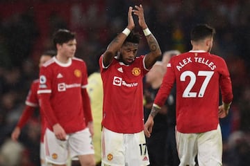 Manchester United's Brazilian midfielder Fred applauds supporters after the English Premier League football match between Manchester United and Arsenal at Old Trafford in Manchester, north west England, on December 2, 2021. - Manchester United won the gam