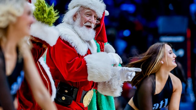 Five straight games and big-name clashes set to light up the league’s marquee holiday tradition..- A man portraying Santa Claus dances during a timeout during the second half of the NBA basketball game between the Memphis Grizzlies and the Atlanta Hawks in Atlanta, Georgia