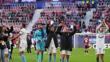 Girona players celebrate their win at the end of the Spanish league football match between CA Osasuna and Girona FC at El Sadar stadium in Pamplona on November 4, 2023. (Photo by Cesar MANSO / AFP)